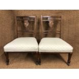 A pair of Victorian marquetry inlaid rosewood boudoir chairs