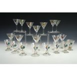 Twelve vintage kitsch cocktail glasses, hand-enamelled with a cockerel design, together with eight