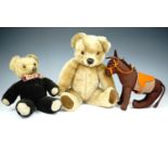 Vintage toys including two Teddy bears and a handmade felt donkey, the larger bear having a wind-