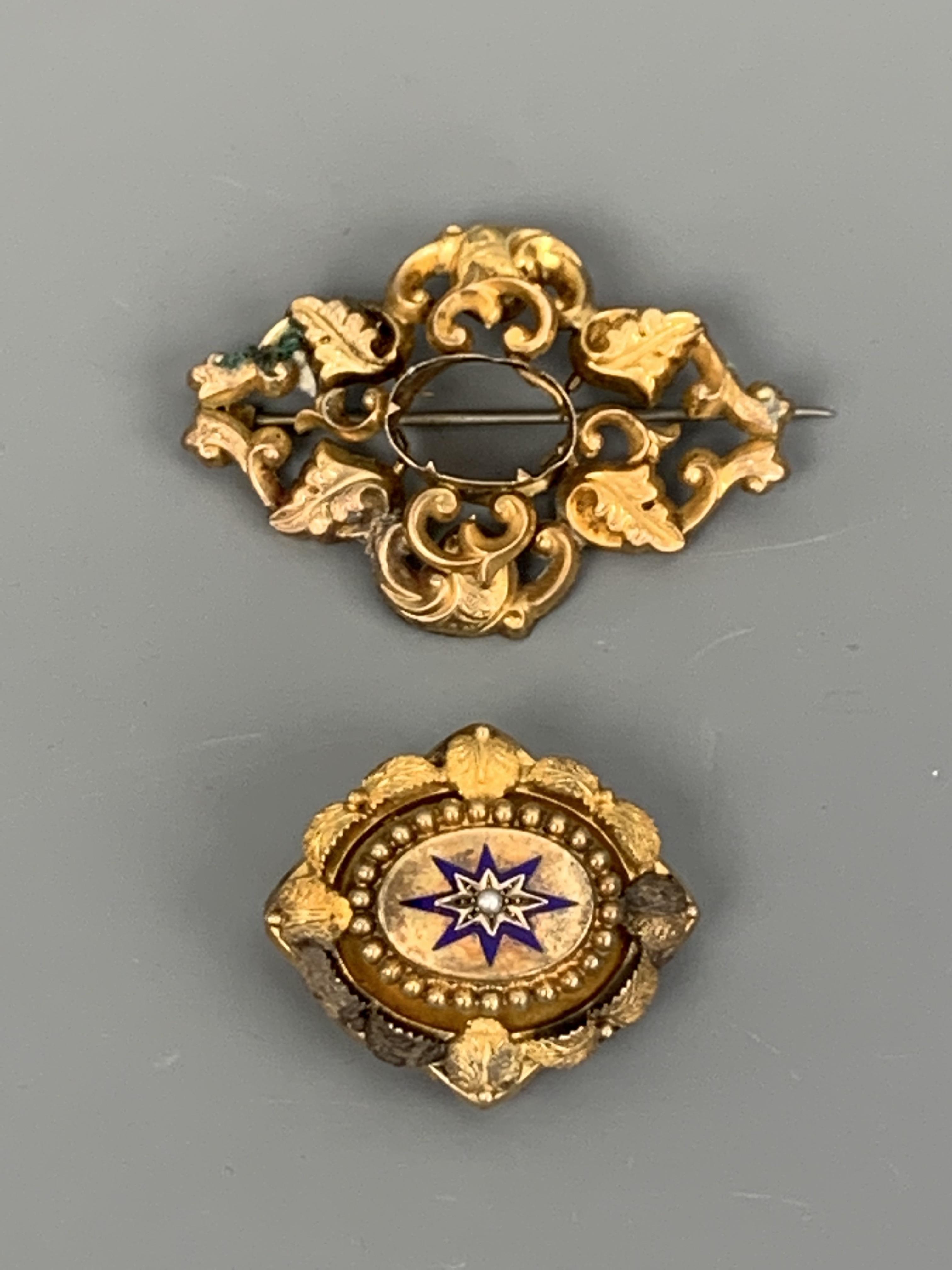 Two Victorian yellow metal brooches together with a stick pin, tested as gold, (a/f), 20 g