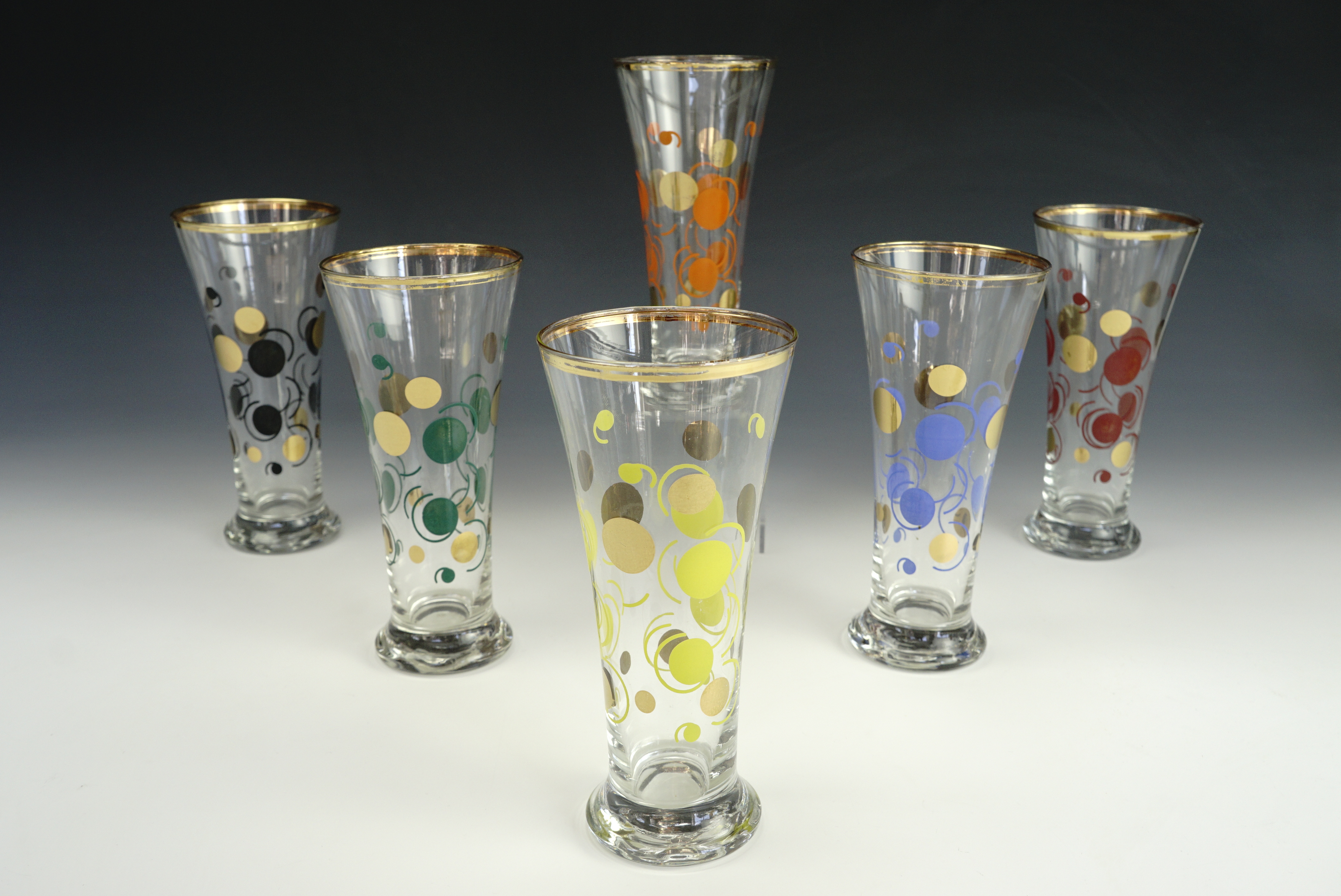 A set of six 1960's kitsch drinking glasses.