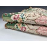 A vintage quilted bedspread for a single bed, printed cotton in imitation patchwork, with applied