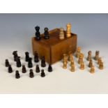 A turned and carved wooden chess set, circa 1930s, Kings 6 cm