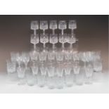 A quantity of cut glass drinking glasses, (two trays)