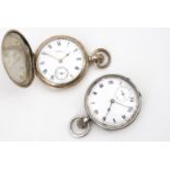 A late 19th / early 20th Century rolled gold hunter cased pocket watch together with a silver pocket