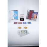 A group of Royal Mint United Kingdom commemorative coins, including Millennium / Year 2000 Five-
