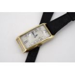 A 1920s gentleman's Art Deco 18 ct gold wrist watch by Tavannes, having a frosted silver face and