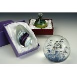 A boxed Mdina glass paperweight and two other weights