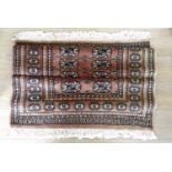 An oriental rug, 1 m x 1.4 m
