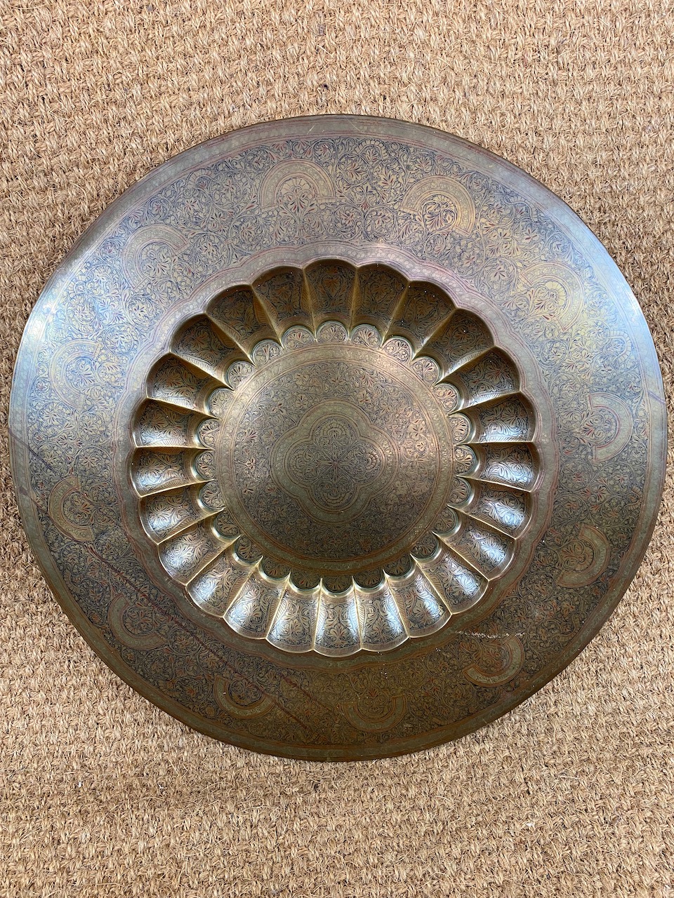A North African or Indian brass rose water table top, 77 cm