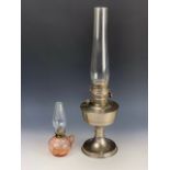 A Super Aladdin paraffin lamp together with a finger oil lamp