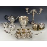 A group of electroplate including a candelabrum, 27 cm high, a three-piece tea set, and a