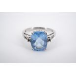 A 9ct white gold "Swiss" blue and white topaz cocktail ring, having a central "antique" cut blue