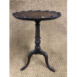 A small reproduction George III mahogany wine table, the top decorated with acanthus scroll