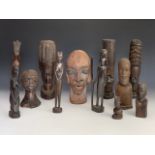 Sundry African wooden carvings together with a ceramic bust, tallest 33 cm