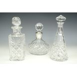 A silver-collared decanter and two others