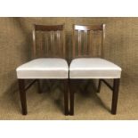 A pair of George V - VI upholstered mahogany standard chairs