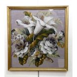 A Victorian gros point and beadwork picture depicting a bouquet of lilies and roses, framed under