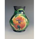 A contemporary Moorcroft vase, of compressed baluster form with elongated and subtly everted neck,