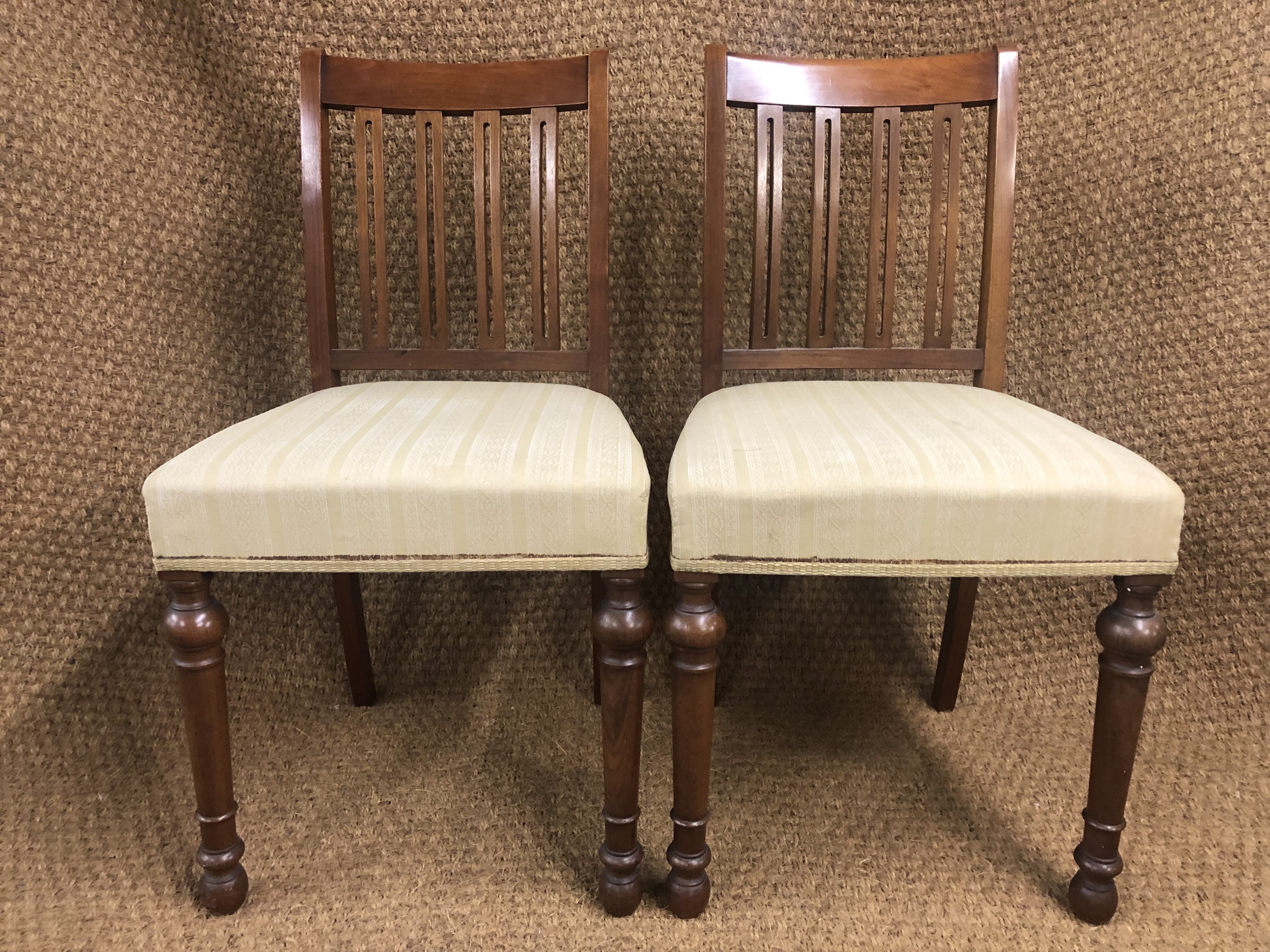 A pair of George V - VI upholstered mahogany standard chairs