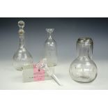 A free-blown and cut glass carafe, two decanters and a boxed Stuart Crystal stopper