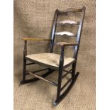 A George V rush-seated ladder-back rocking chair, 87 cm