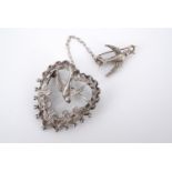 An Elizabeth II silver sweetheart brooch, of Victorian influence, depicting a swallow within a