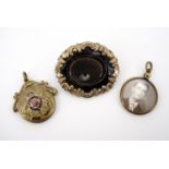 A Victorian rolled-gold hairwork locket brooch, a Great War sweetheart pendant locket, and one other