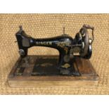 A Singer hand sewing machine F3787660