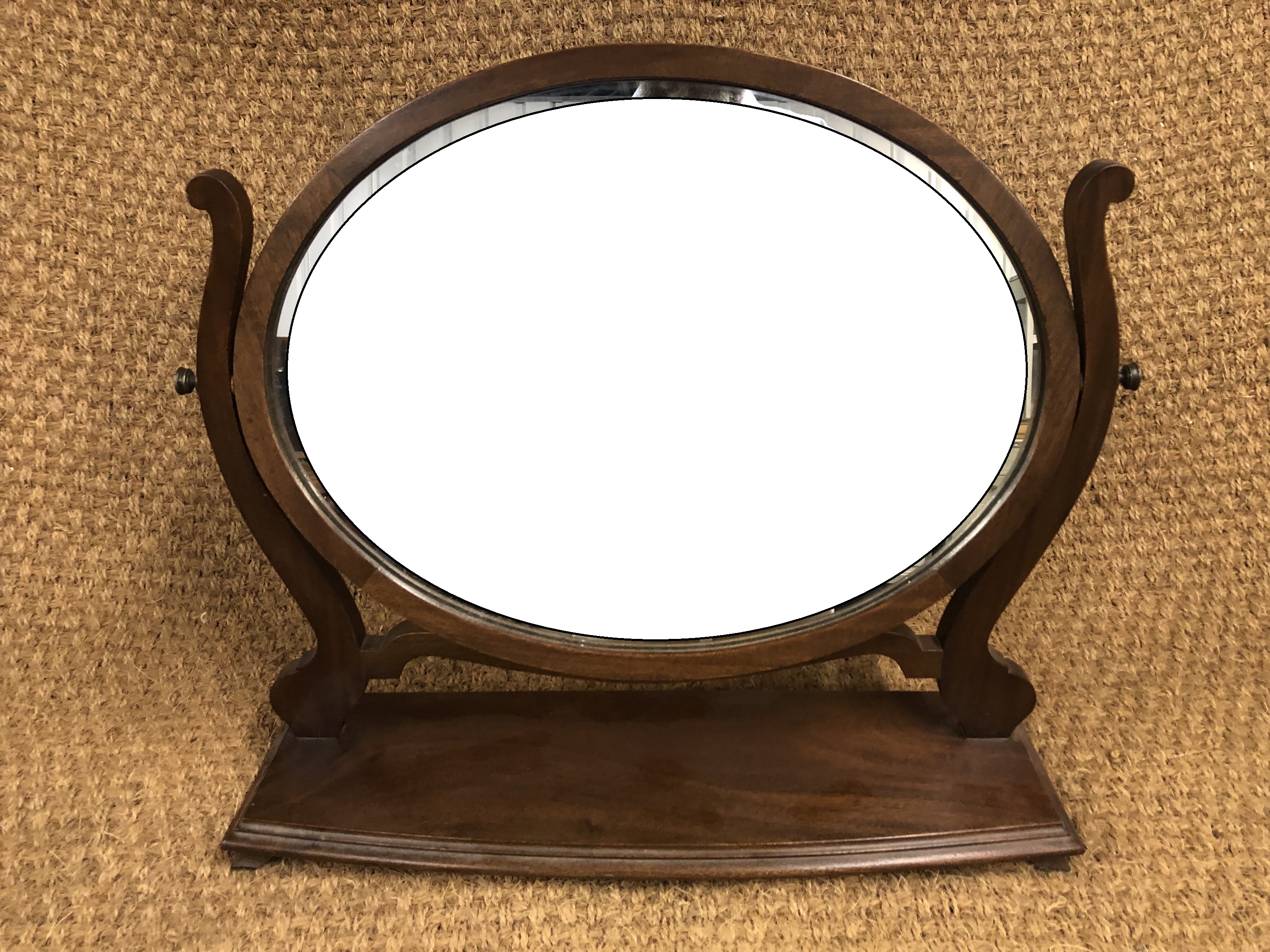 An early 20th Century reproduction Hepplewhite style mahogany swivel toilet mirror, 58 cm x 55 cm