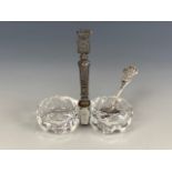 An early 20th Century Ypres / Calais commemorative white metal and cut glass salt cellar and spoon