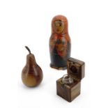 A late 19th Century Jerusalem olive wood travelling ink well together with a turned fruitwood pear