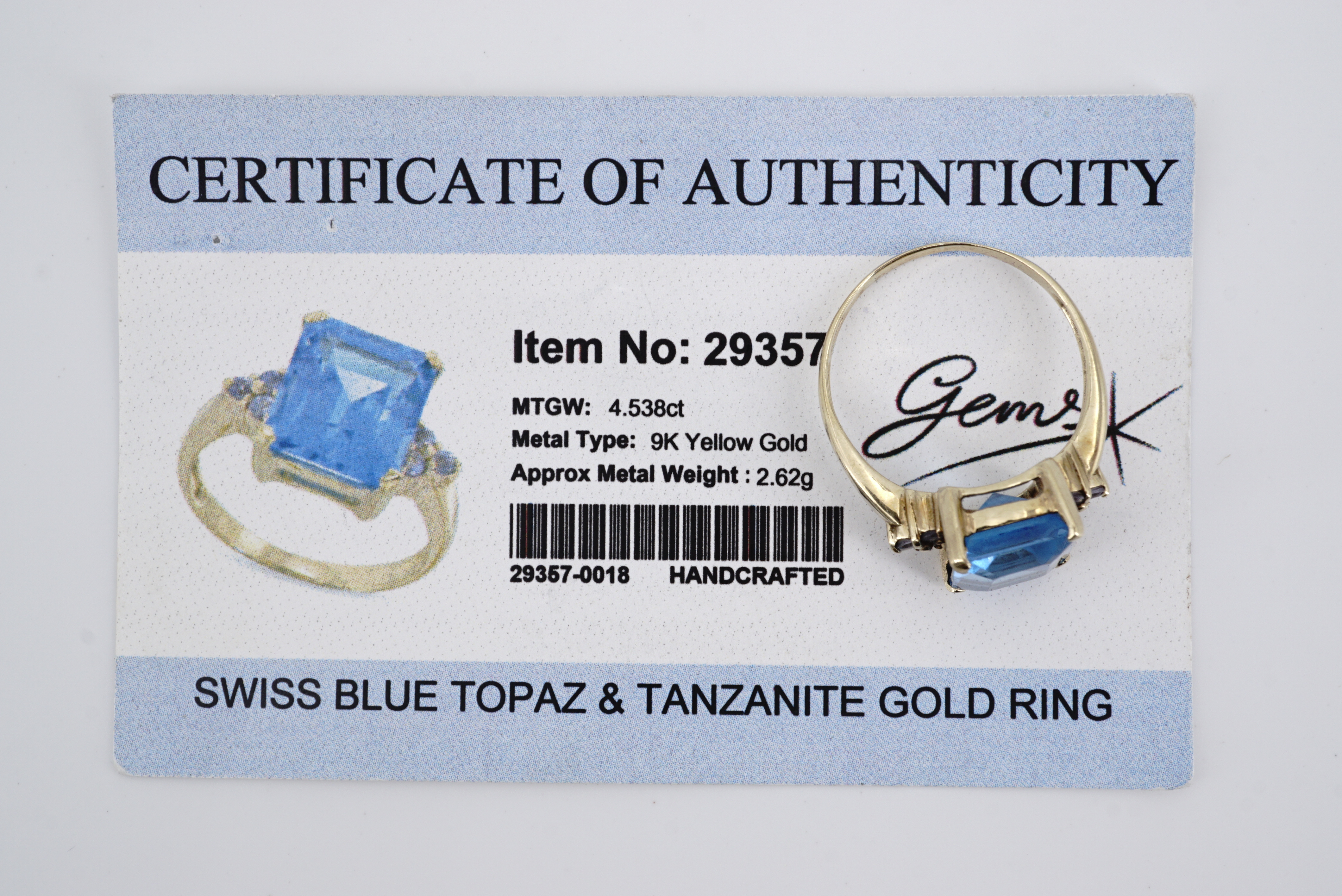 A contemporary 9ct gold and "Swiss" blue Topaz and tanzanite cocktail ring, having a central - Image 3 of 3
