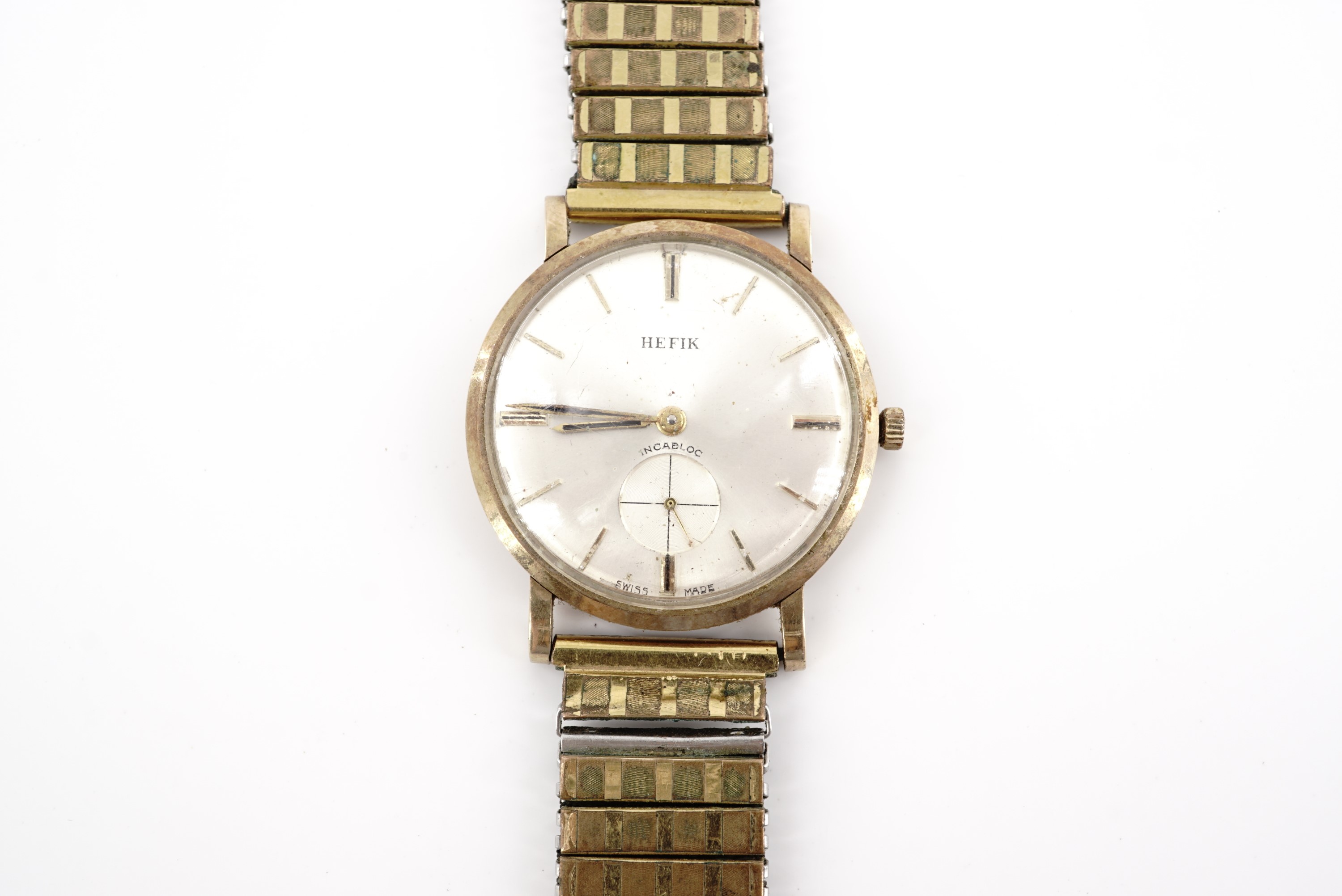 A 1960s Hefik 9 ct gold wristwatch, having a Swiss 17 jewel manual wing movement and radially