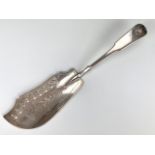 A Georgian Scottish Provincial silver fish slice, fiddle and shell pattern, with engraved