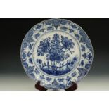 A late 17th / 18th Century large Delft blue-and-white tin-glazed earthenware dish, decorated in
