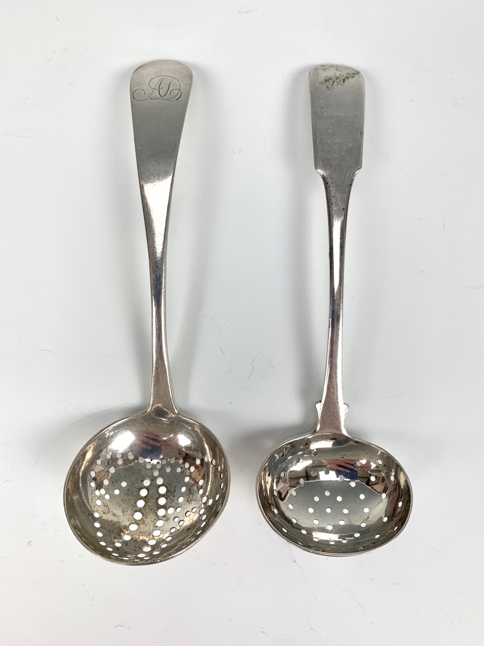Two Georgian silver dredging / casting spoons, Heron, Edinburgh, 1818, and William Ritchie, Perth,