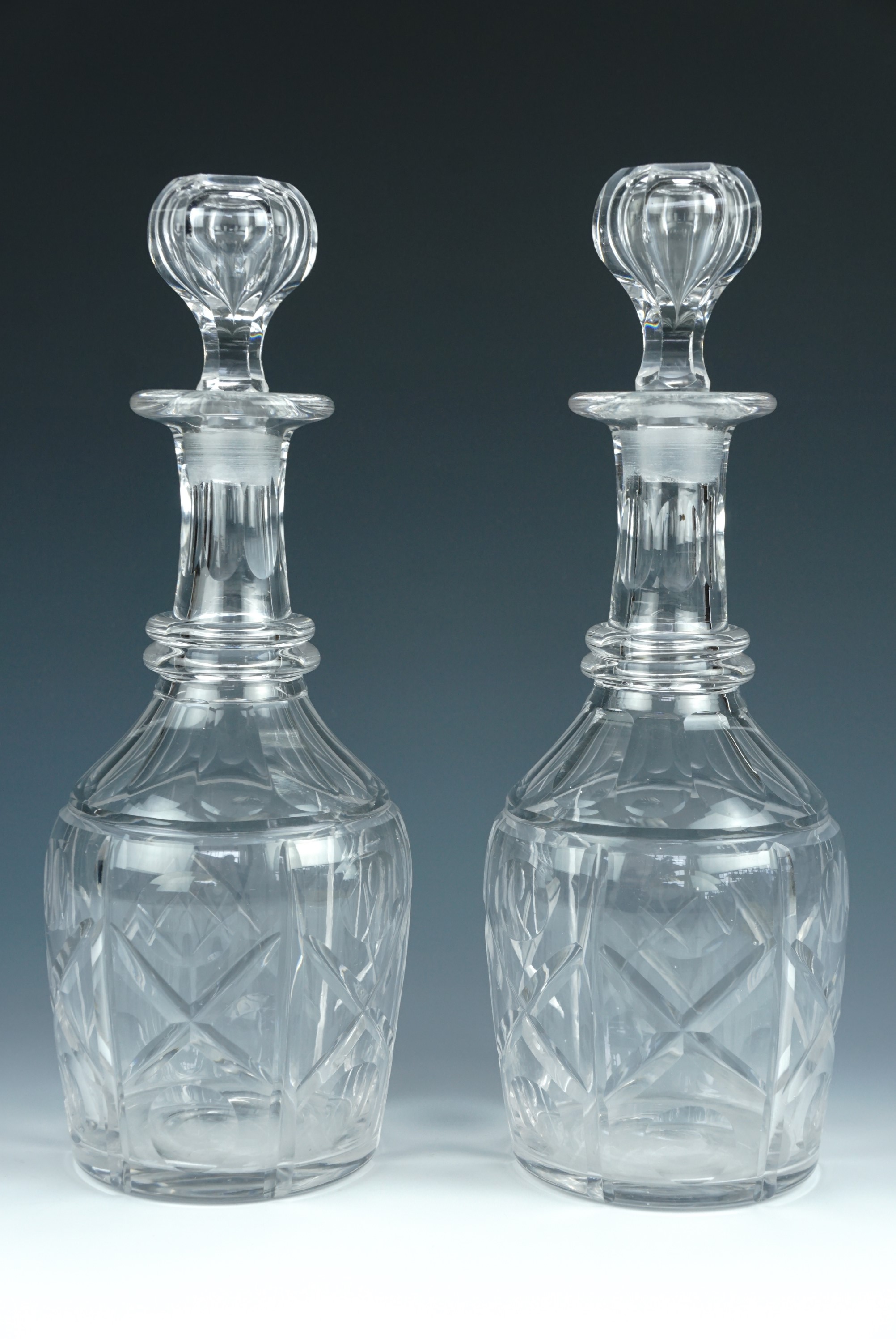A pair of Victorian cut glass decanters, 30 cm