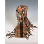 A vintage Burberry cashmere scarf, of slender design with tassels to each side, 132 x 16 cm