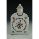 A late 18th / early 19th Century porcelain tea caddy, decorated with enamelled floral swags and