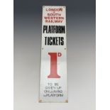 A vintage enamelled sign for London & South Western Railway advertising train "Platform Tickets 1d",