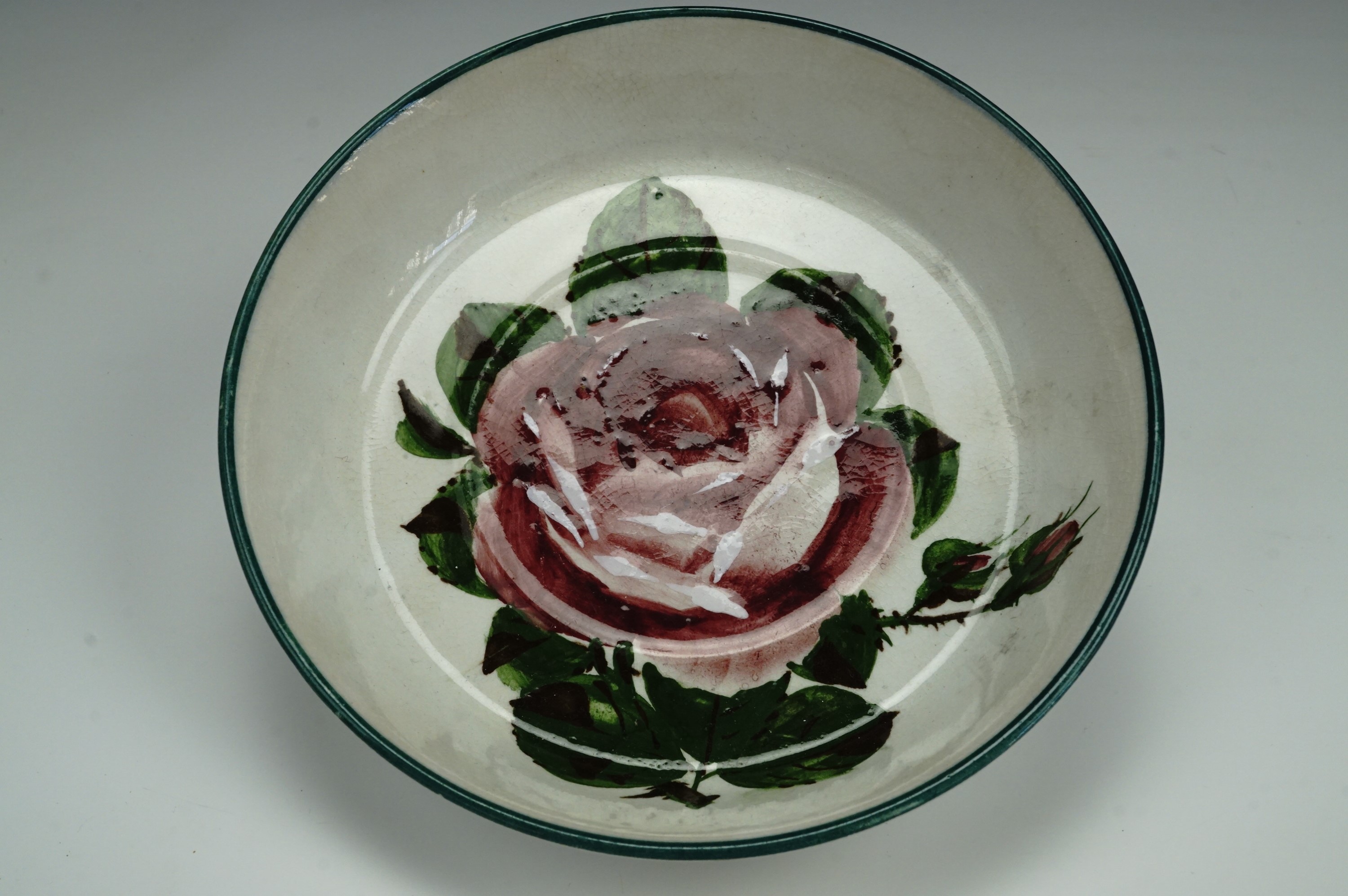 A late 19th Century Wemyss dish, circular section, the decoration depicting a cabbage rose, 13 cm,