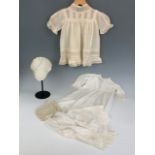 A late Victorian baby's christening gown, with machine embroidered lace bodice and ribbon inserts,