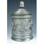 An antique electroplate Britannia metal tobacco jar and cover, of cylindrical form, decorated in the