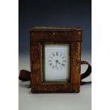 A late 19th Century carriage clock of diminutive stature, 7.5 cm excluding handle, in transit case