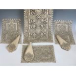 A Belle Epoque luncheon table mat set of Aesthetic influence, comprising table runner, eight place