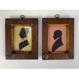 A pair of Victorian bronzed silhouettes, being portraits of a Mr and Mrs Ord, inscribed labels