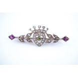 An early 20th Century Scottish suffragette acrostic brooch, comprising gem set crowned heart between