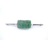 A 1930s carved jade and seed pearl bar brooch, set on 9 ct precious white metal, 5.5 cm
