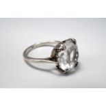 A vintage white sapphire solitaire ring, round-cut and crown set on a high-carat precious white